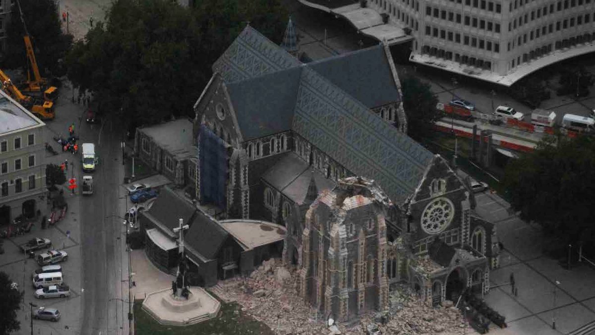 Aerial view of Christ Church Cathedral after the February 2011 earthquake, with the tower gone and rubble in the Square